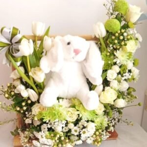 Floral bunny arrangement with tulips, roses, chrysanthemums, lisianthus, hypericum, spray roses, asters, baby’s breath, ruscus and ferns