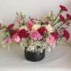 Large ceramic vase floral arrangement with roses, statice, baby’s breath, carnations and lisianthus