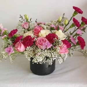 Large ceramic vase floral arrangement with roses, statice, baby’s breath, carnations and lisianthus