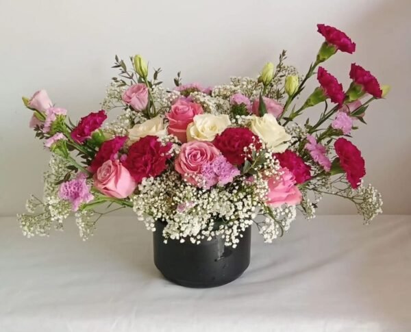 Large ceramic vase floral arrangement with roses, statice, baby’s breath, carnations and lisianthus