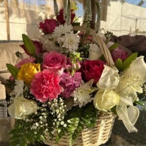 Large floral basket arrangement with Veronica spuria, carnations, roses, matthiola, chrysanthemums, baby’s breath, lilies and ferns