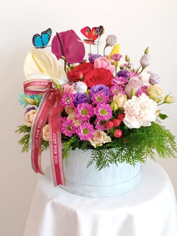 Medium floral box with tulips, anthurium, roses, carnations, and greenery – MuscatFnC